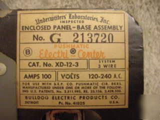 Vintage pushmatic bulldog electric breakers on panel