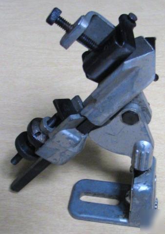 Drill bit sharpener grinding attachment part